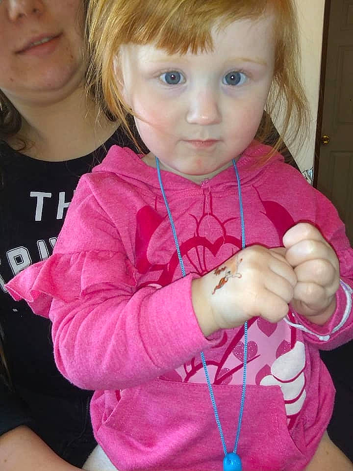 Amelia is registered to the contest to win money with this photo: arm, baby, blond, brown_hair, cheek, child, ear, face, finger, hand, person, pink, play, skin, smile, thumb, toddler