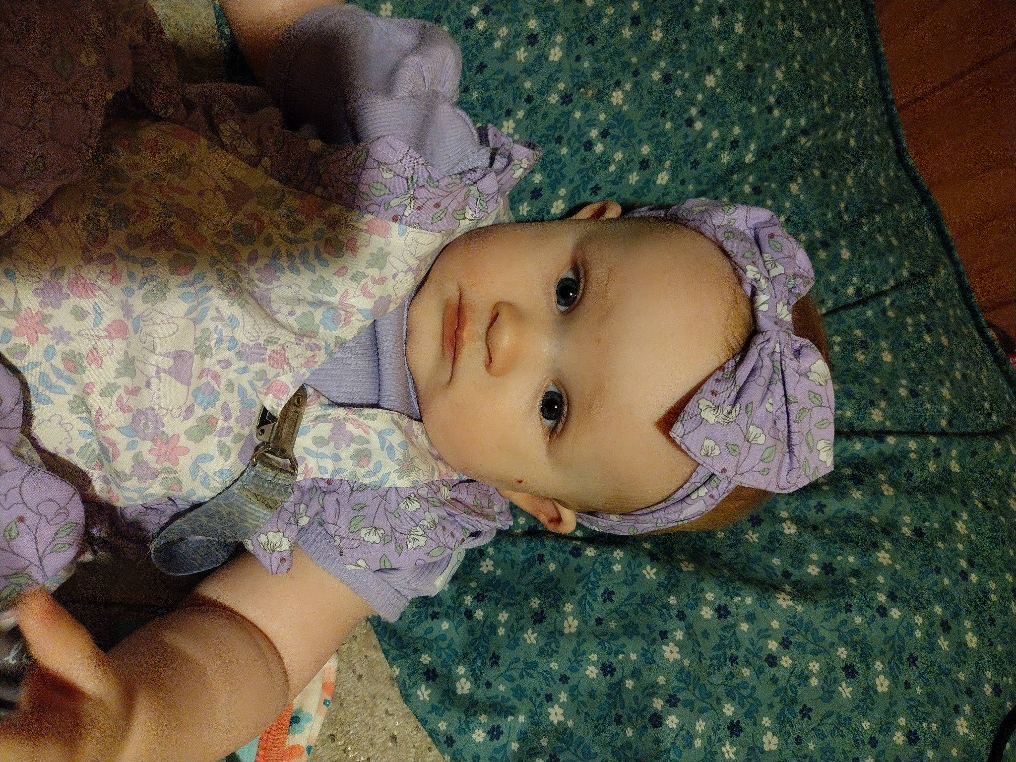 Skyla is registered to the contest to win money with this photo: baby, cheek, chest, child, doll, eye, eyelash, grass, hand, head, human_body, linens, pattern, person, sitting, skin, sleeve, toddler, toy, trunk