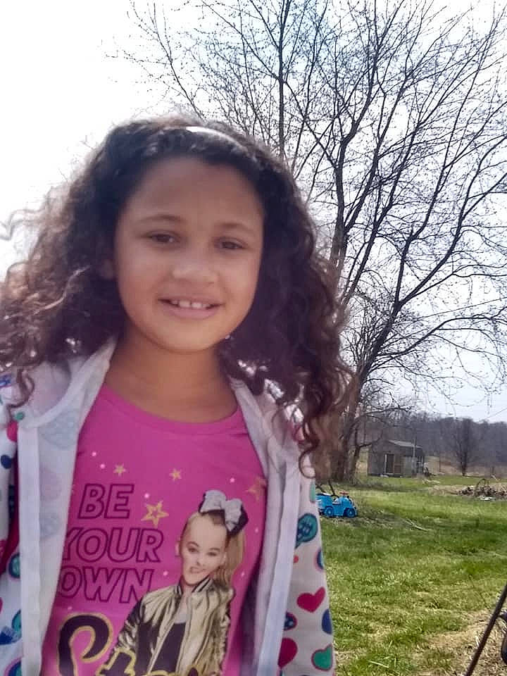 Maliah is registered to the contest to win money with this photo: beauty, black_hair, child, cool, eye, face, forehead, fun, grass, hair, hairstyle, happy, head, joy, lip, long_hair, outerwear, person, pink, skin