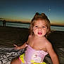 beach, blanket, child, curly_hair, cute, evening, moon, nature, ocean, outdoor, person, portrait, relaxing, sand, sky, sunset, swimsuit, toddler, twilight, water