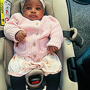 Mirabel joined the competition — help win amazing prizes! baby, infant, car_seat, headband, flower, pink_sweater, knitted_clothing, floral_shorts, black_tights, pink_shoes, floor, carpet, seatbelt, indoor, child, cute, portrait, person, clothing, footwear