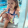 child, girl, smile, curly_hair, window, sunlight, colorful_skirt, peach_top, purple_straps, barefoot, indoor, carpet, curtain, happy, portrait, daylight, window_sill, nature_view, pool, greenery