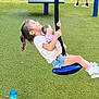 child, girl, doll, swing, playground, grass, outdoor, toy, smiling, happy, person, legs, shoes, shorts, tshirt, rope, activity, fun, recreation, park