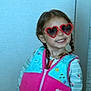 child, girl, smiling, heart_shaped_sunglasses, braids, vest, swim_vest, aqua_swim_school, colorful_clothing, indoor, portrait, happy, cute, fashion, playful, person, young, fun, glasses, casual