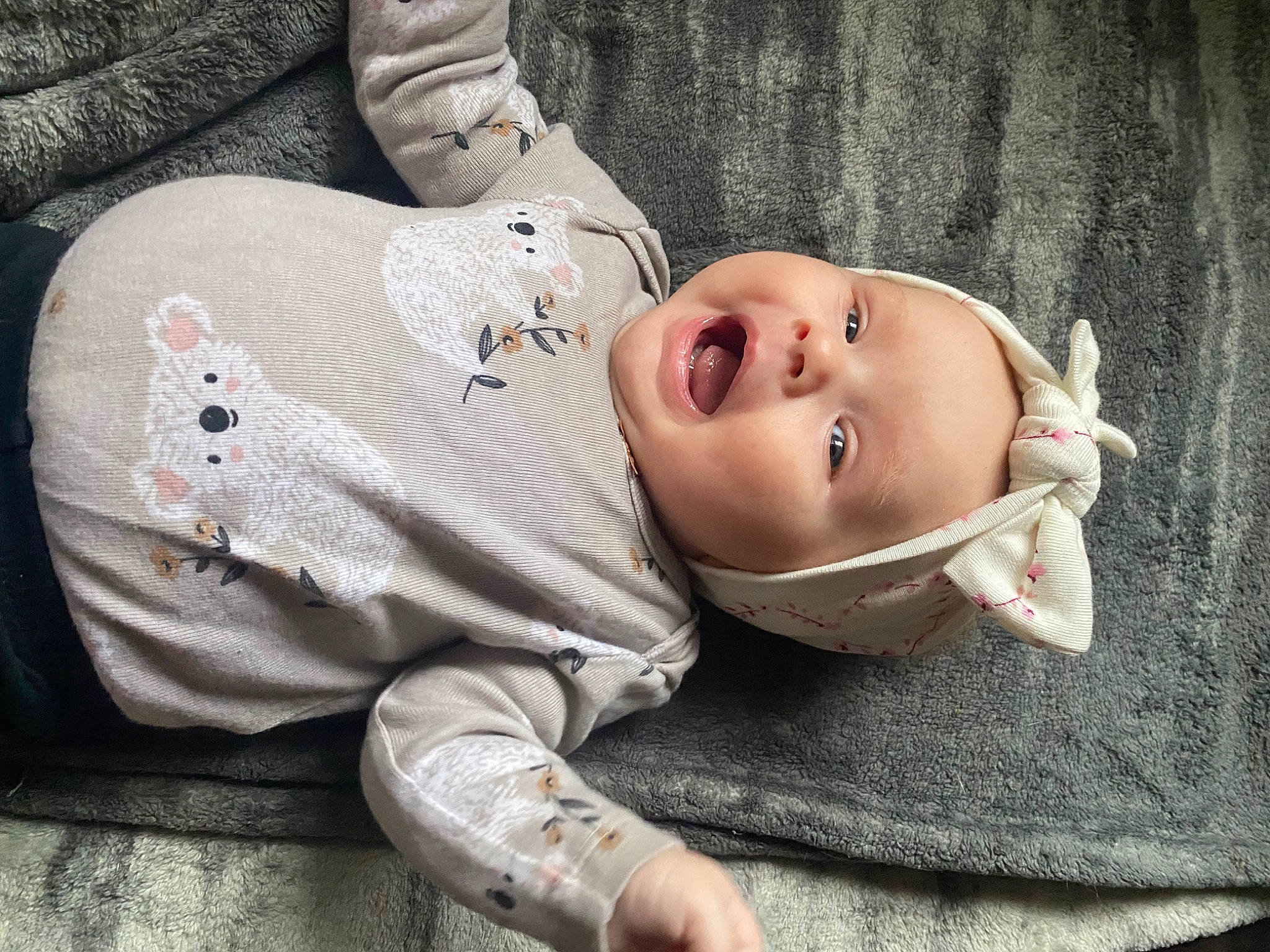 Josie is registered to the contest to win money with this photo: baby, baby_toddler_clothing, cheek, child, chin, comfort, eye, flash_photography, grass, grey, happy, headwear, lip, mouth, nose, person, skin, sleeve, smile, toddler