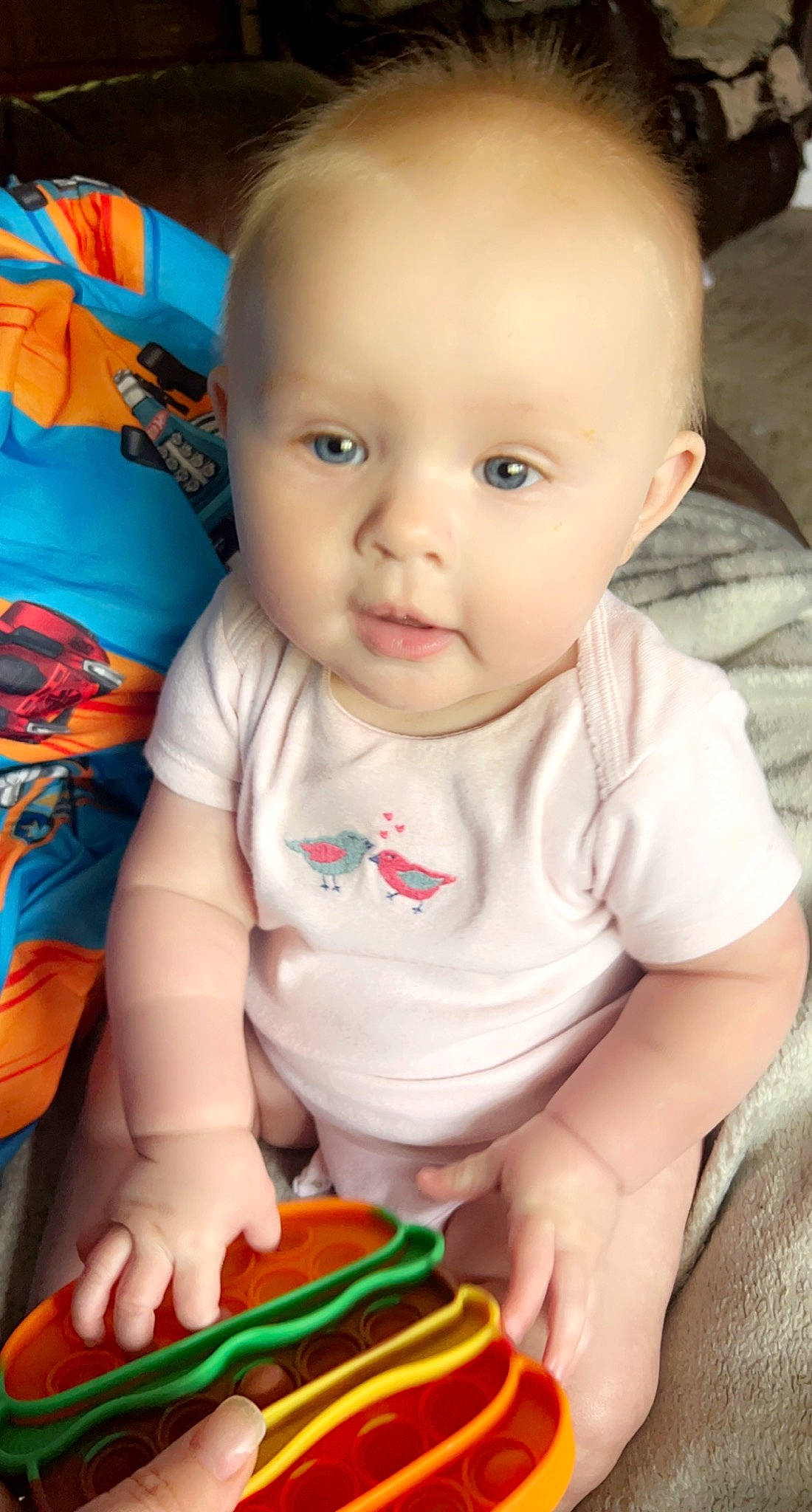 Josie is registered to the contest to win money with this photo: baby, baby_toddler_clothing, cake, cheek, child, chin, finger, green, human_body, iris, mouth, nose, orange, organ, person, product, skin, sleeve, t_shirt, toddler