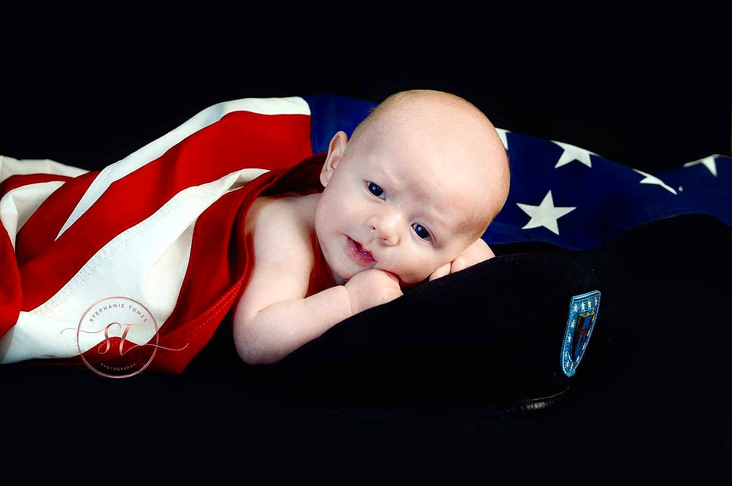 Braylon is registered to the contest to win money with this photo: baby, baby_carriage, baby_products, baby_toddler_clothing, carmine, child, comfort, costume_hat, darkness, event, eye, fashion_accessory, flash_photography, happy, linens, person, portrait_photography, sitting, sleeve, smile