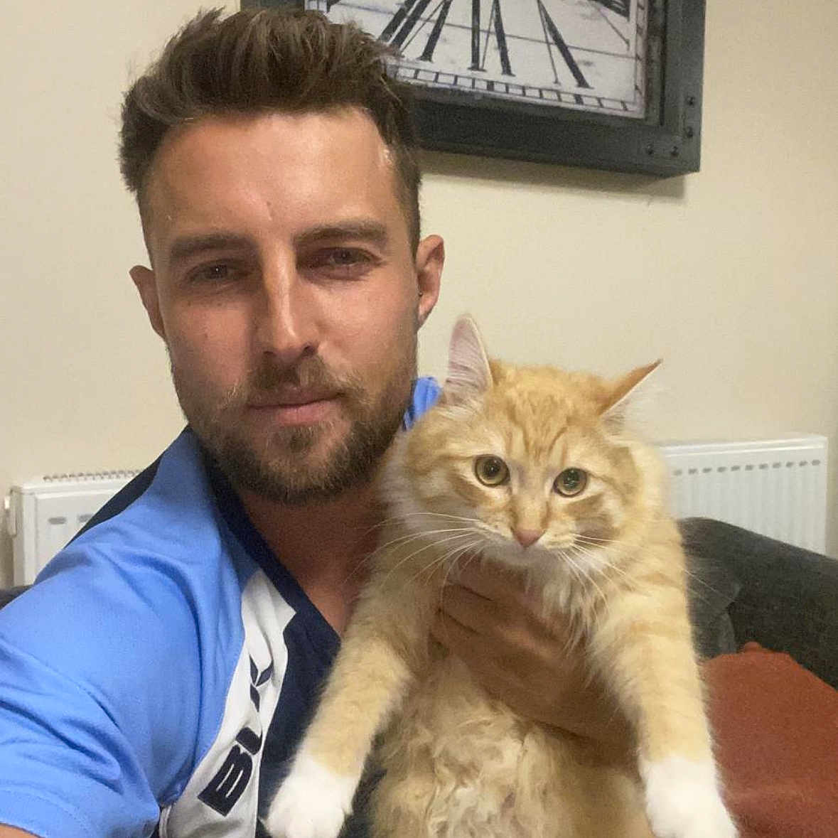 Buddy joined the competition — help win amazing prizes! adult, analogclock, animal, cat, clock, clothing, doctor, face, hair, head, indoors, kitten, male, man, person, pet, photography, portrait, t_shirt, wristwatch