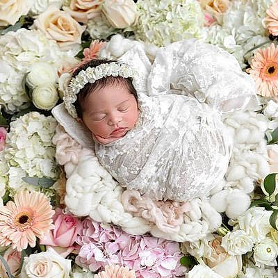 Ellen joined the competition — help win amazing prizes! artificial_flower, baby, child, cut_flowers, floral_design, floristry, flower, flower_arranging, person, petal, pink, plant, rose, smile, toddler