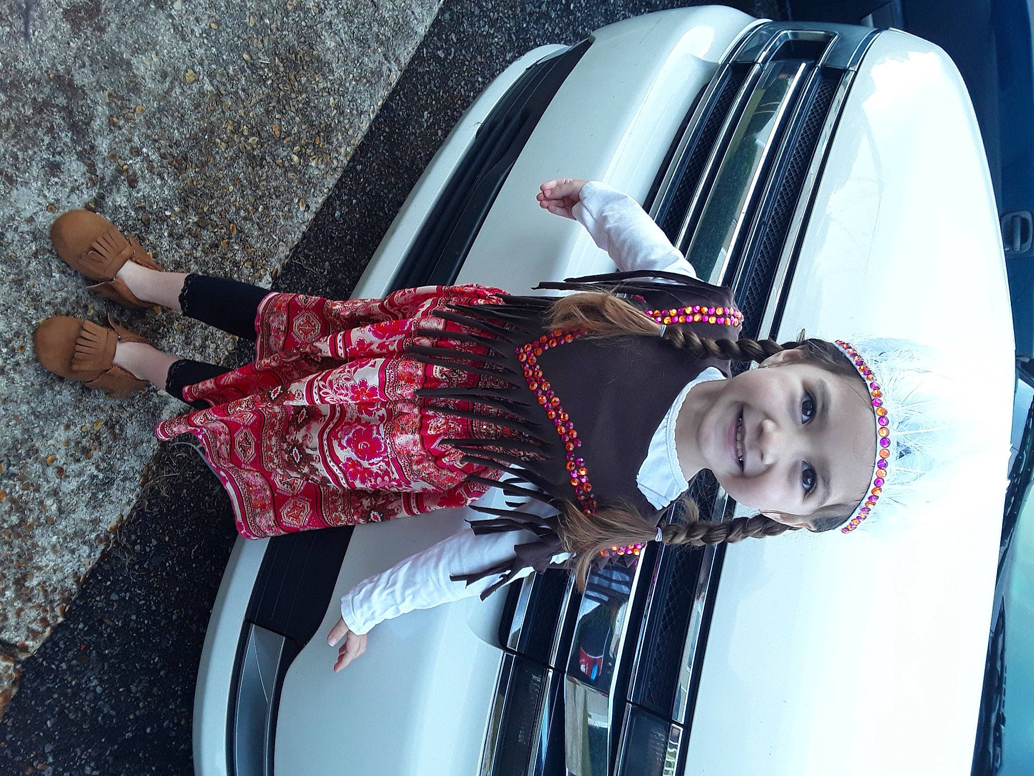 Rihanna is registered to the contest to win money with this photo: black_hair, car, headwear, joy, person, vehicle