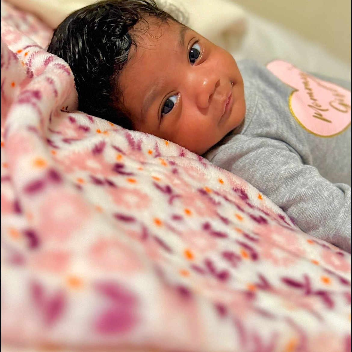 Joyce is registered to the contest to win money with this photo: baby, blanket, face, happy, head, newborn, person, photography, portrait, quilt, smile