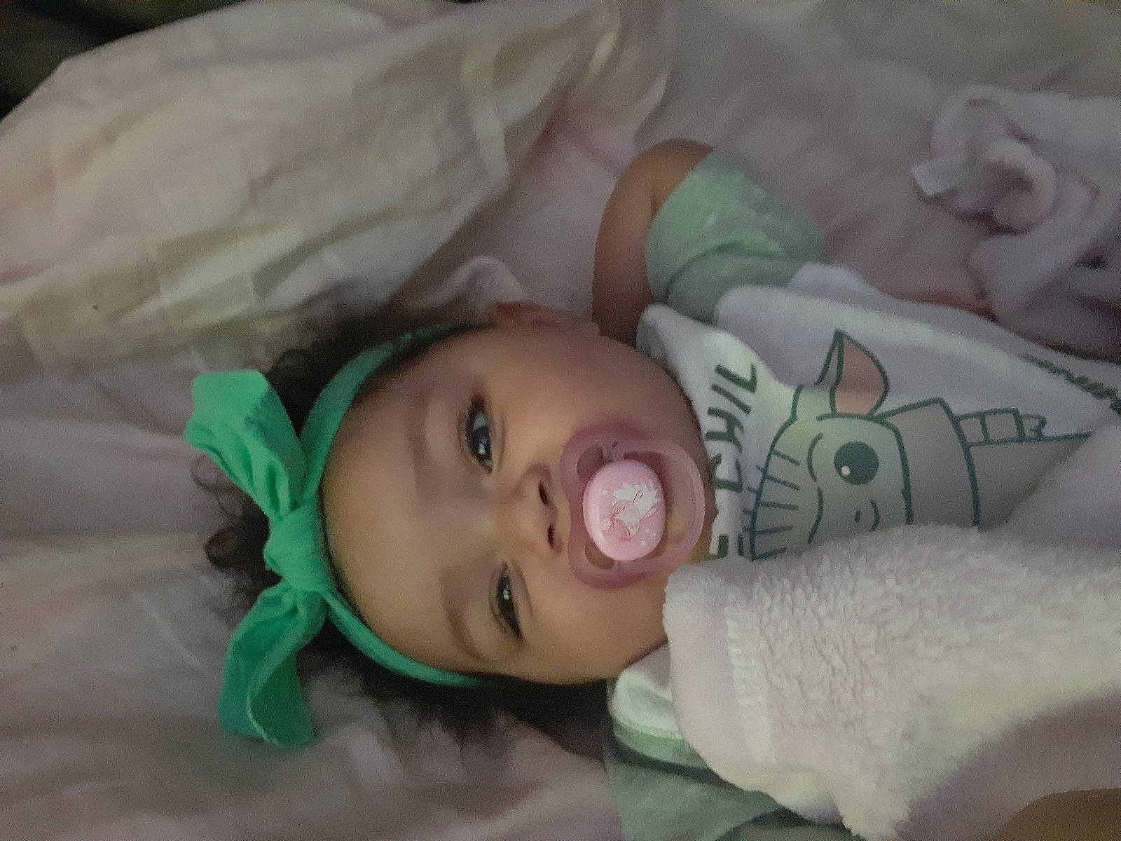 Stella is registered to the contest to win money with this photo: baby, baby_products, baby_toddler_clothing, bedding, bedtime, blanket, cheek, child, comfort, eyelash, headwear, linens, nap, nose, person, room, skin, sleep, toddler