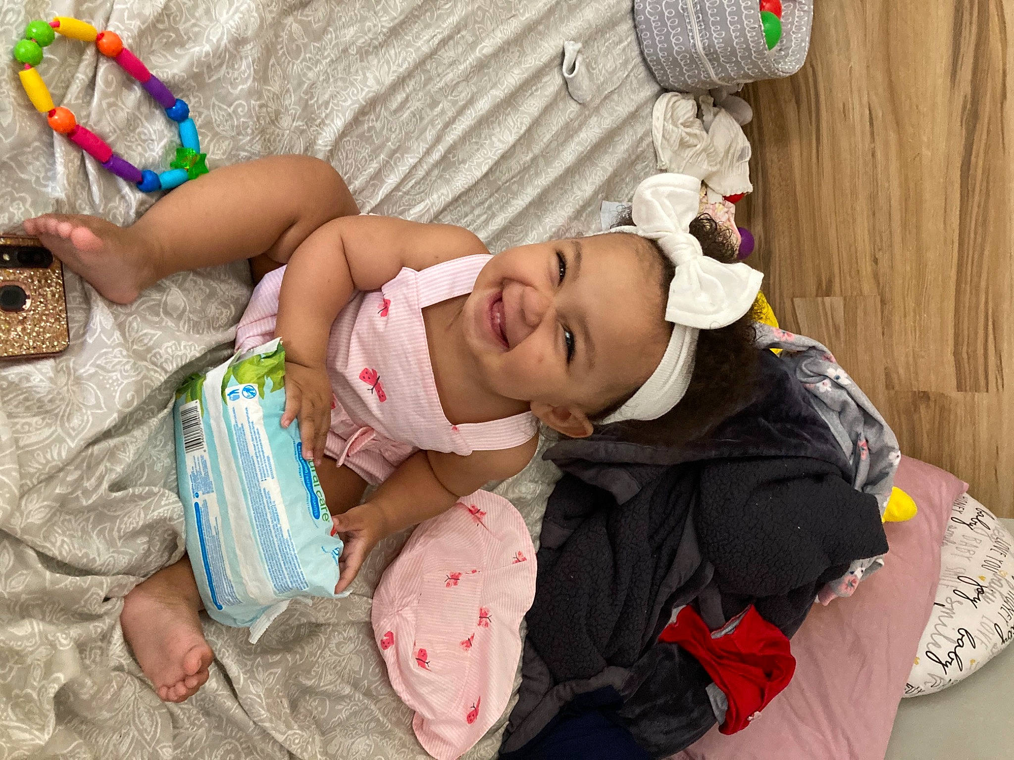 Stella is registered to the contest to win money with this photo: adaptation, baby, baby_products, baby_toddler_clothing, child, comfort, event, finger, fun, happy, hat, human, joy, mammal, person, play, room, sitting, skin, smile