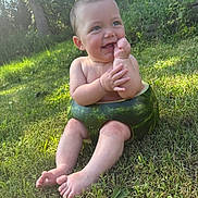 Parker joined the competition — help win amazing prizes! baby, child, watermelon, fruit, grass, outdoor, nature, smiling, happy, sitting, green, sunlight, trees, summer, cute, playful, skin, barefoot, toddler, fun