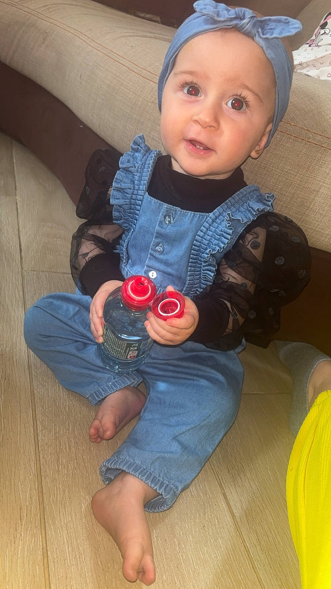 Kassie participe au concours pour gagner de l'argent avec cette photo : baby, bodypart, bottle, cap, clothing, coat, couch, face, finger, furniture, hand, hat, head, jacket, jeans, pants, person, photography, portrait, sitting