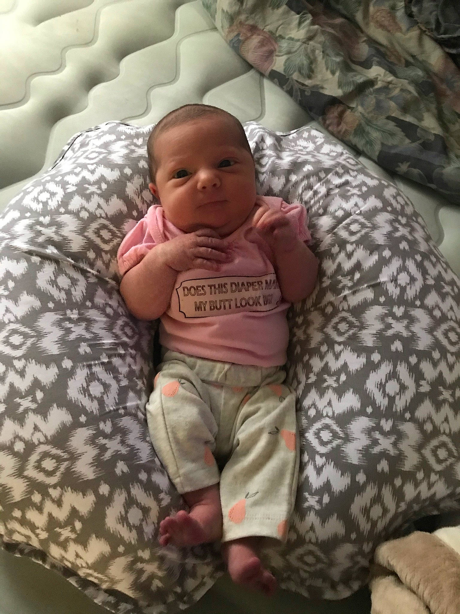 Emberlyn joined the competition — help win amazing prizes! baby, baby_toddler_clothing, bedding, child, comfort, head, human_leg, linens, mammal, military_camouflage, mouth, pattern, person, room, sitting, skin, sleeve, t_shirt, textile, toddler