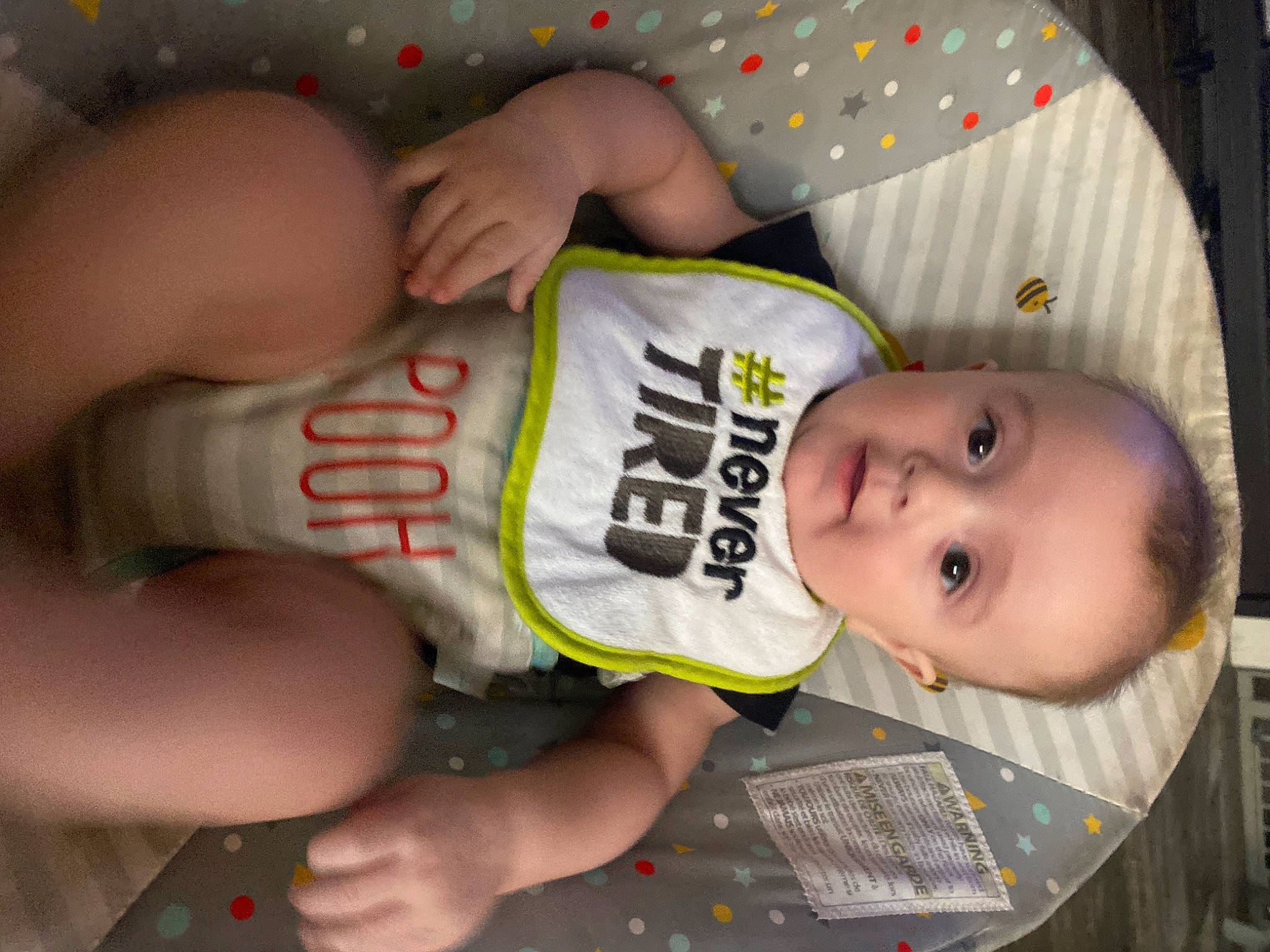 Junior is registered to the contest to win money with this photo: baby, baby_products, baby_toddler_clothing, cheek, chest, child, elbow, eye, finger, hand, human_body, mouth, nail, person, skin, sleeve, smile, thigh, thumb, toddler