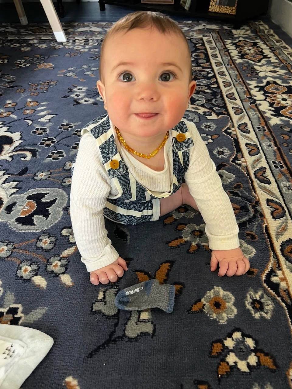 Augustus is registered to the contest to win money with this photo: baby, baby_toddler_clothing, cheek, child, eye, face, floor, flooring, fun, happy, people_in_nature, person, photograph, road_surface, sitting, skin, sleeve, smile, snapshot, toddler