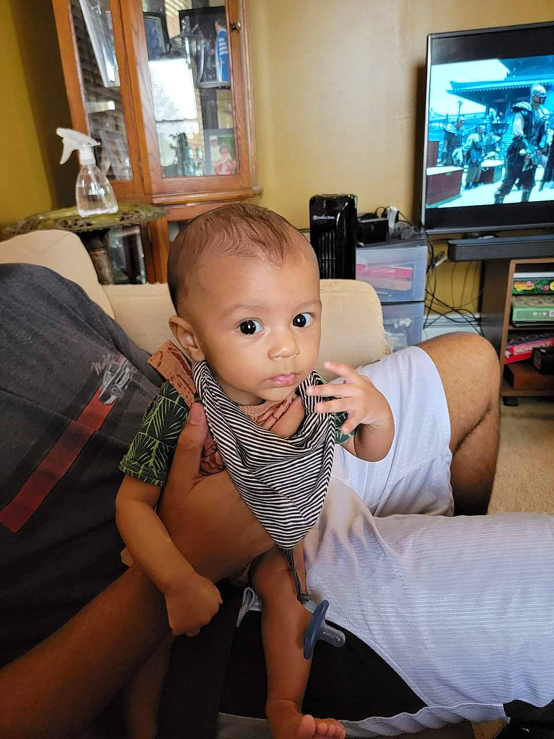 Solomon joined the competition — help win amazing prizes! baby, comfort, display_device, elbow, flooring, fun, hairstyle, happy, human_leg, joint, knee, lap, living_room, person, picture_frame, shoulder, television, television_set, thigh, toddler