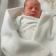 Owen participe au concours pour gagner de l'argent avec cette photo : baby, bed, blanket, child, clothing, cozy, cute, fabric, indoors, infant, newborn, peaceful, person, portrait, resting, sleeping, soft, warm, white, wrapped