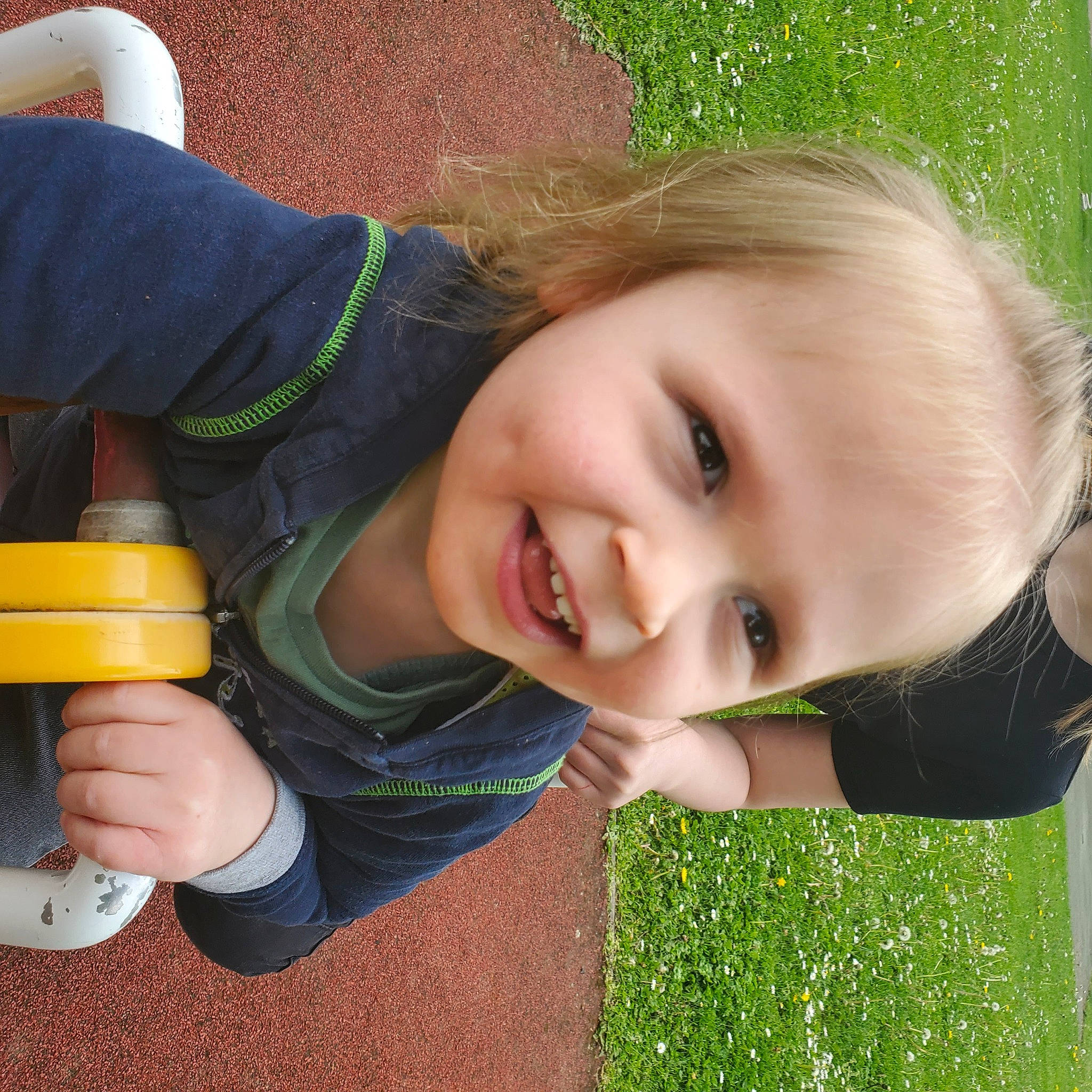 Nahël participe au concours pour gagner de l'argent avec cette photo : cheek, child, flash_photography, fun, gesture, grass, green, happy, joy, laugh, leisure, people_in_nature, person, play, recreation, sitting, smile, soil, summer, thumb