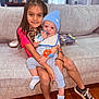 Shine joined the competition — help win amazing prizes! child, baby, girl, infant, couch, living_room, window, blinds, toy, bib, hat, socks, sneakers, floor, wood_floor, bracelet, smile, hug, home_decor, portrait