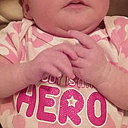 Bella is registered to the contest to win money with this photo: baby, casual, child, clothing, cute, expression, eyes, face, hands, head, indoor, infant, newborn, onesie, person, pink_clothing, portrait, sitting, skin, soft_lighting