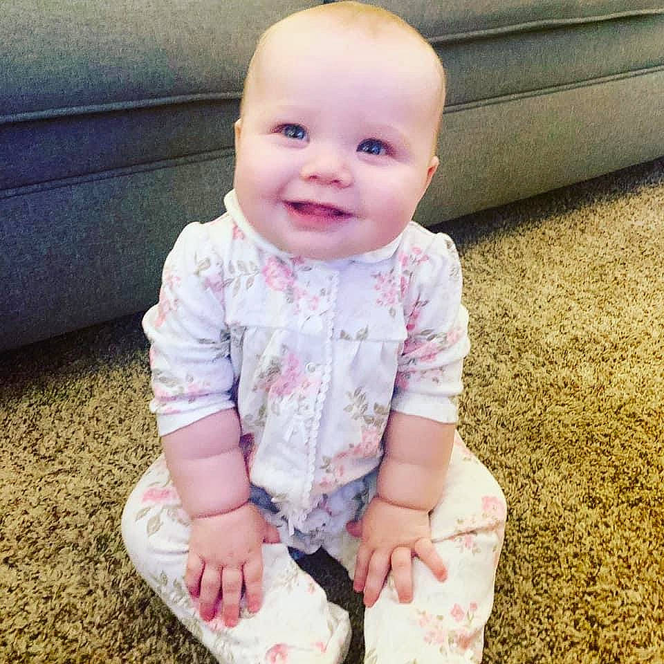 Evelynn is registered to the contest to win money with this photo: baby, baby_toddler_clothing, beauty, cheek, child, cool, eye, face, footwear, head, joy, leg, outerwear, people, person, pink, product, sitting, skin, sleeve