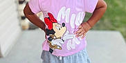 Zai'Lynn joined the competition — help win amazing prizes! child, girl, smiling, curly_hair, pink_shirt, minnie_mouse, skirt, standing, outdoor, sidewalk, house, confident, happy, earrings, shoes, young, portrait, casual_clothing, daylight, background_blur