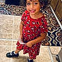 Zai'Lynn joined the competition — help win amazing prizes! black_shoes, casual_clothing, child, curly_hair, earrings, footwear, happy, indoors, kitchen, minnie_mouse, paper, patterned_rug, person, red_dress, rug, smiling, standing, tile_floor, wooden_cabinets, young