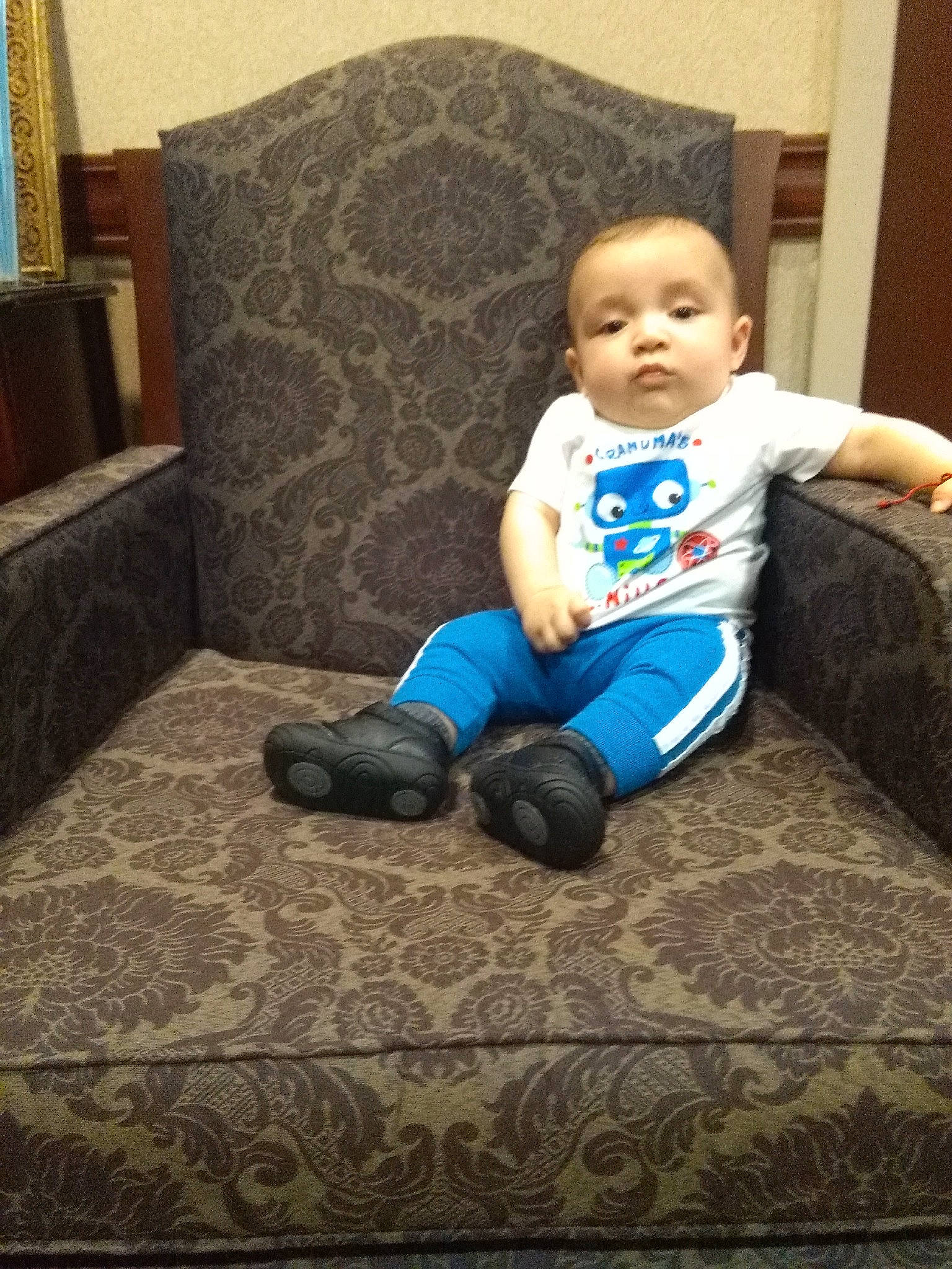 Omar joined the competition — help win amazing prizes! arm, baby, child, couch, electronic_device, furniture, leg, person, play, sitting, smile, technology, toddler