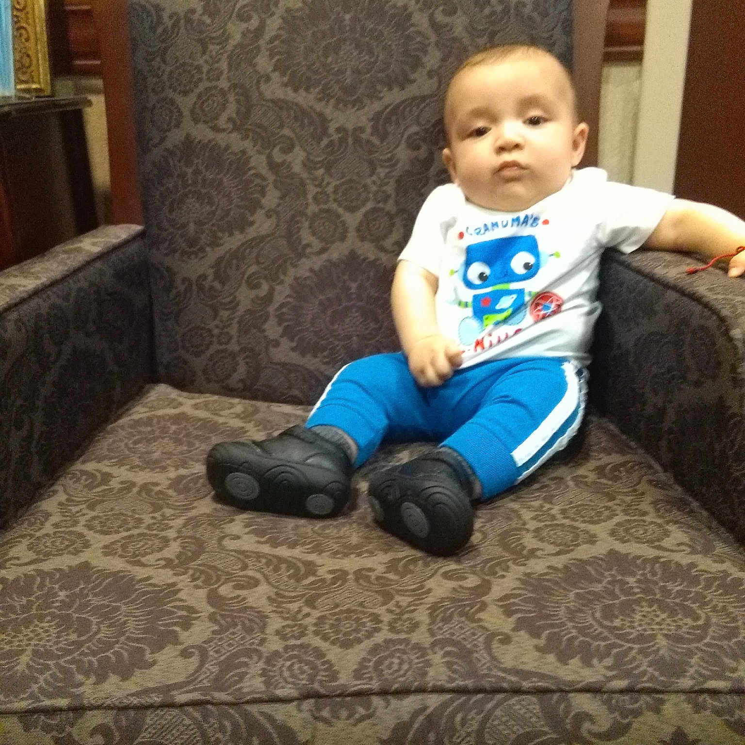 Omar joined the competition — help win amazing prizes! arm, baby, child, couch, electronic_device, furniture, leg, person, play, sitting, smile, technology, toddler