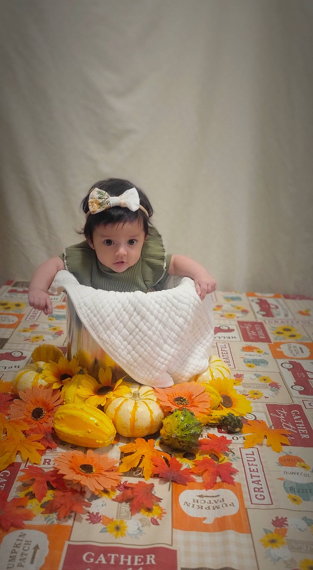 Aria is registered to the contest to win money with this photo: baby, baseballcap, cap, clothing, face, flower, food, fruit, hat, head, leaf, person, photography, plant, portrait, pottedplant, produce, pumpkin, squash, vegetable