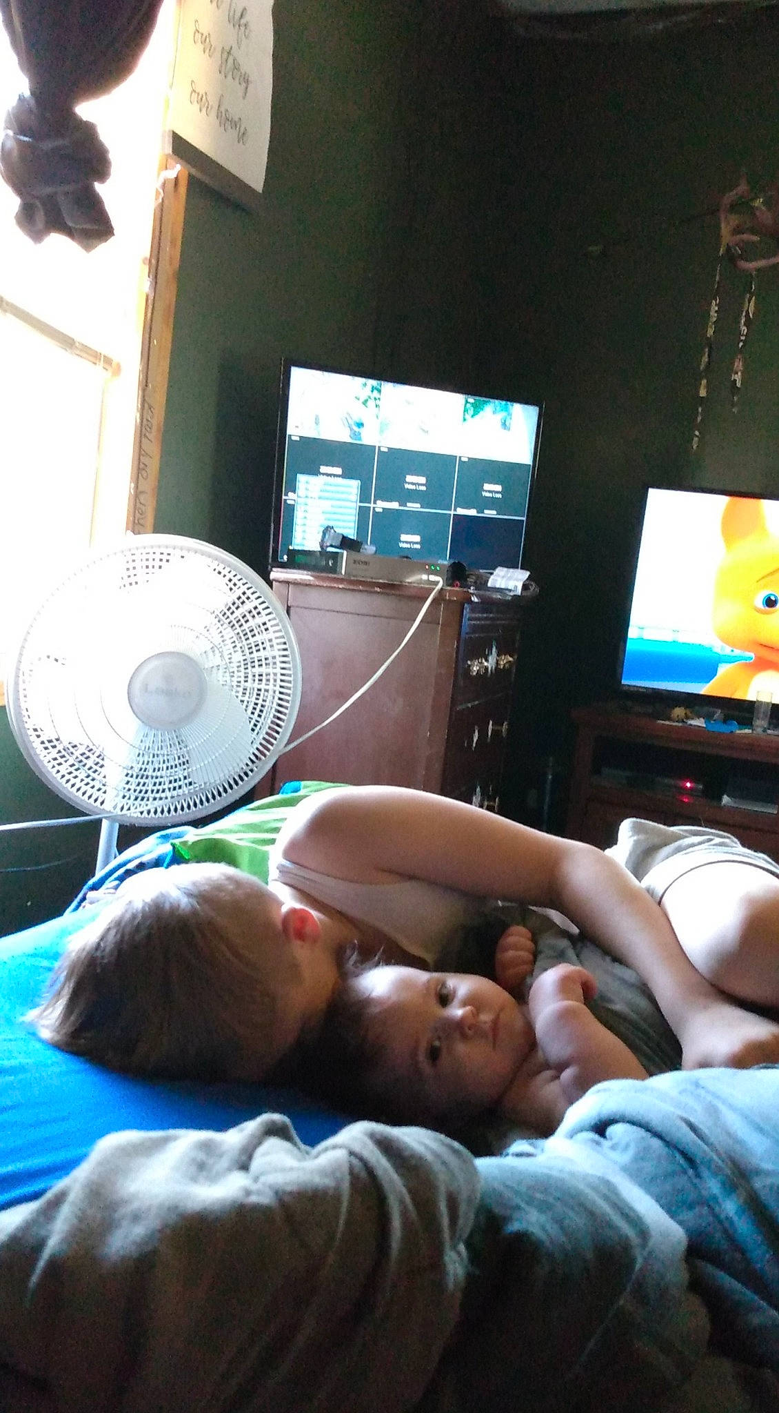 Bently is registered to the contest to win money with this photo: abdomen, baby, barefoot, bed, bedtime, child, comfort, diaper, display_device, electric_fan, foot, home_appliance, mechanical_fan, nap, person, sleep, sole, television, toddler, toe
