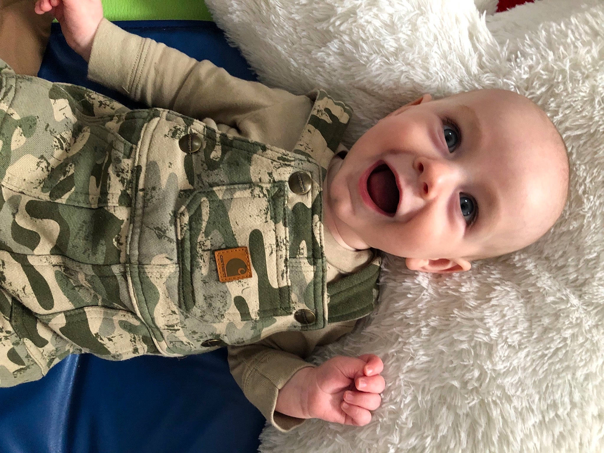 Lance joined the competition — help win amazing prizes! camouflage, cheek, eye, facial_expression, gesture, hand, happy, head, human_body, military_camouflage, military_uniform, nose, organ, person, skin, sleeve, smile, textile, toddler, water