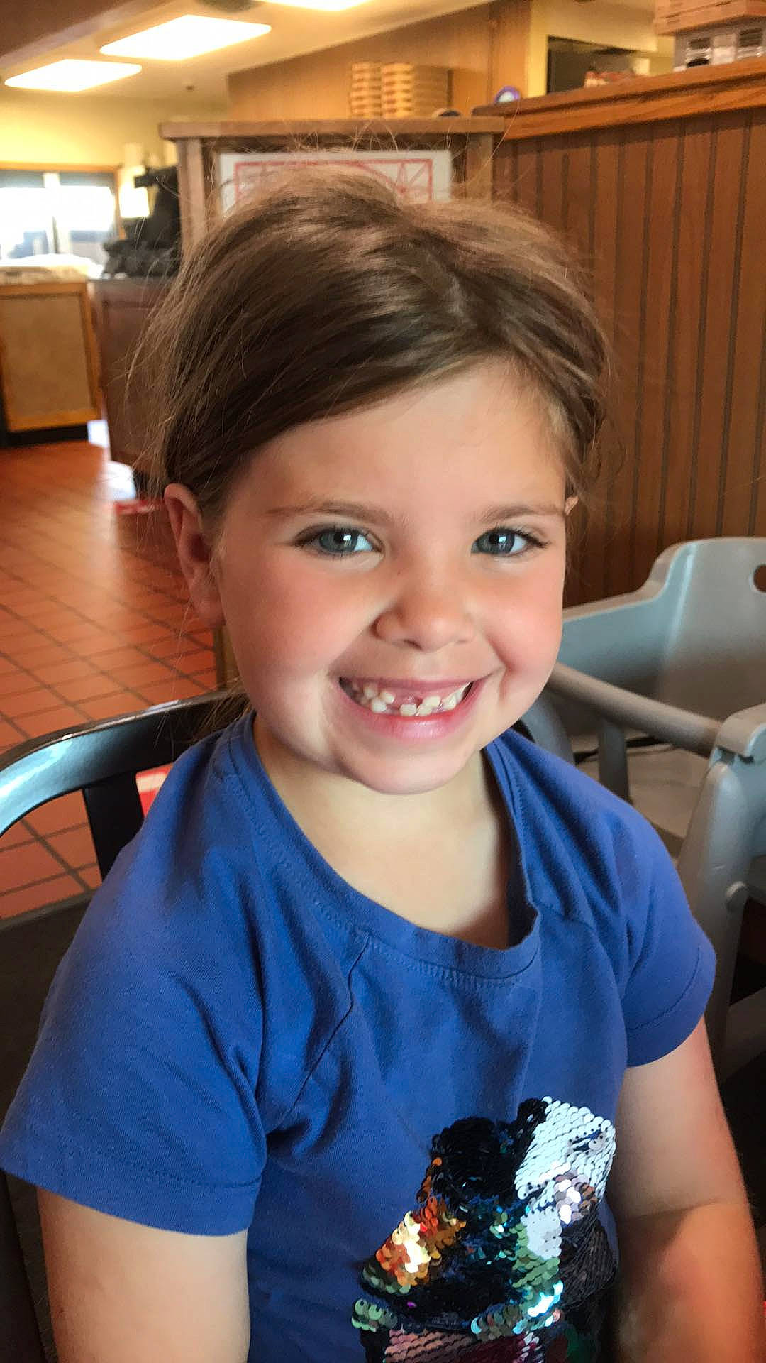 Aliana is registered to the contest to win money with this photo: chair, cheek, child, electric_blue, event, eyelash, fun, happy, iris, joy, laugh, person, portrait_photography, recreation, room, sitting, smile, t_shirt, toddler, vacation