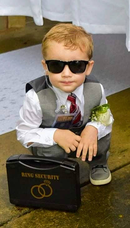 Maverick joined the competition — help win amazing prizes! blond, box, child, cool, dress_shirt, eyewear, flooring, formal_wear, fun, gesture, glasses, goggles, hairstyle, person, sitting, street_fashion, sunglasses, tie, toddler, vision_care