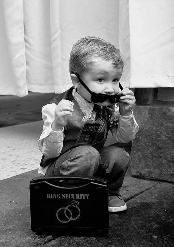 Maverick is registered to the contest to win money with this photo: art, baby, black, black_and_white, child, curtain, flooring, happy, monochrome, monochrome_photography, person, portrait_photography, road, sitting, sneakers, standing, stock_photography, street, style, toddler