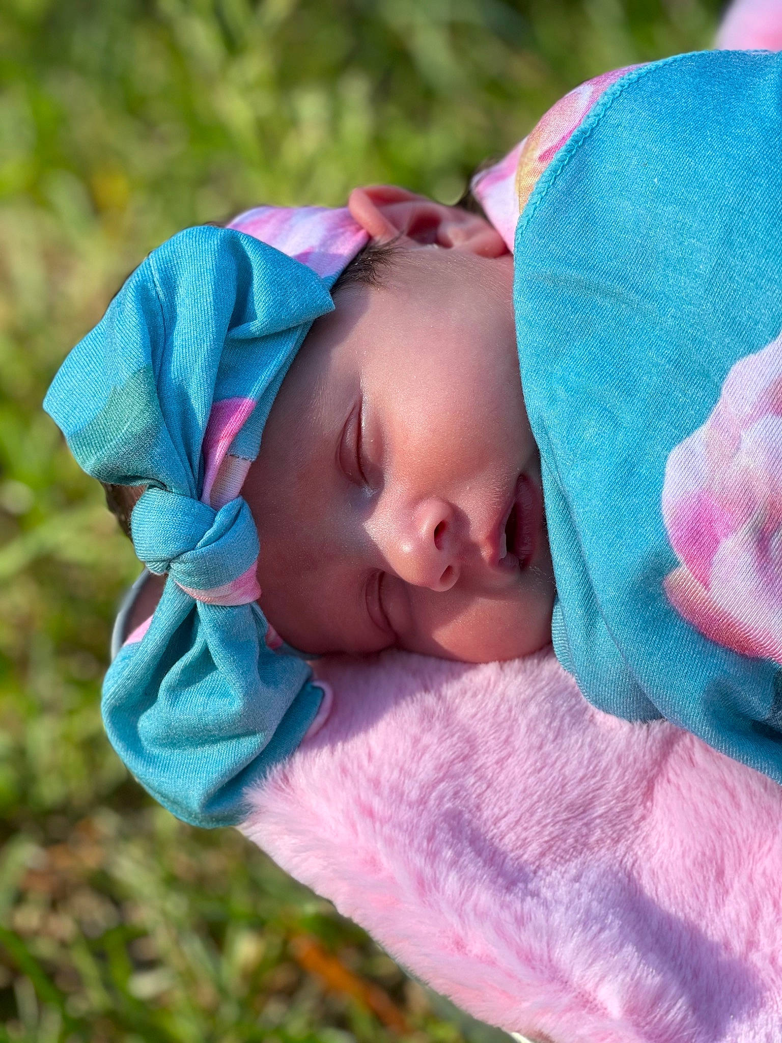Norah joined the competition — help win amazing prizes! baby, baby_toddler_clothing, cheek, child, comfort, electric_blue, eye, face, fashion_accessory, grass, happy, headwear, linens, lip, magenta, nose, person, pink, purple, skin