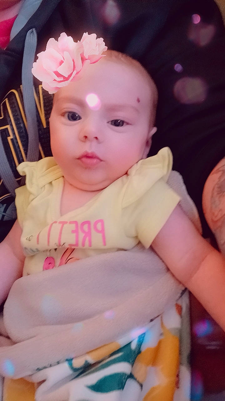 Sydney is registered to the contest to win money with this photo: baby, baby_toddler_clothing, beauty, cheek, chin, dress, eye, eyebrow, finger, fun, happy, headgear, headwear, human_body, iris, lip, mouth, person, pink, product