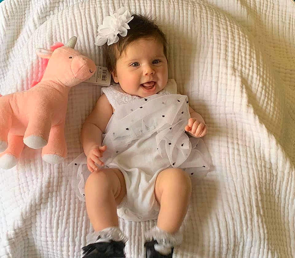 Ryli is registered to the contest to win money with this photo: arm, baby, baby_products, baby_sleeping, baby_toddler_clothing, cheek, child, finger, hand, head, human, joint, leg, person, product, sibling, sitting, skin, sleeve, textile