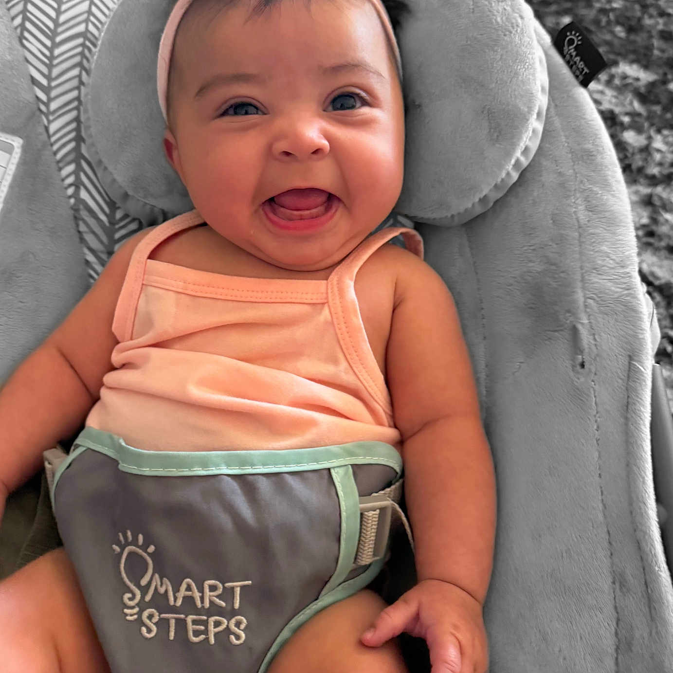 Bobbielee is registered to the contest to win money with this photo: baby, baby_seat, bow, child, clothing, comfort, cushion, cute, expression, face, happy, headband, indoor, infant, person, seat, skin, smiling, text, tongue_out