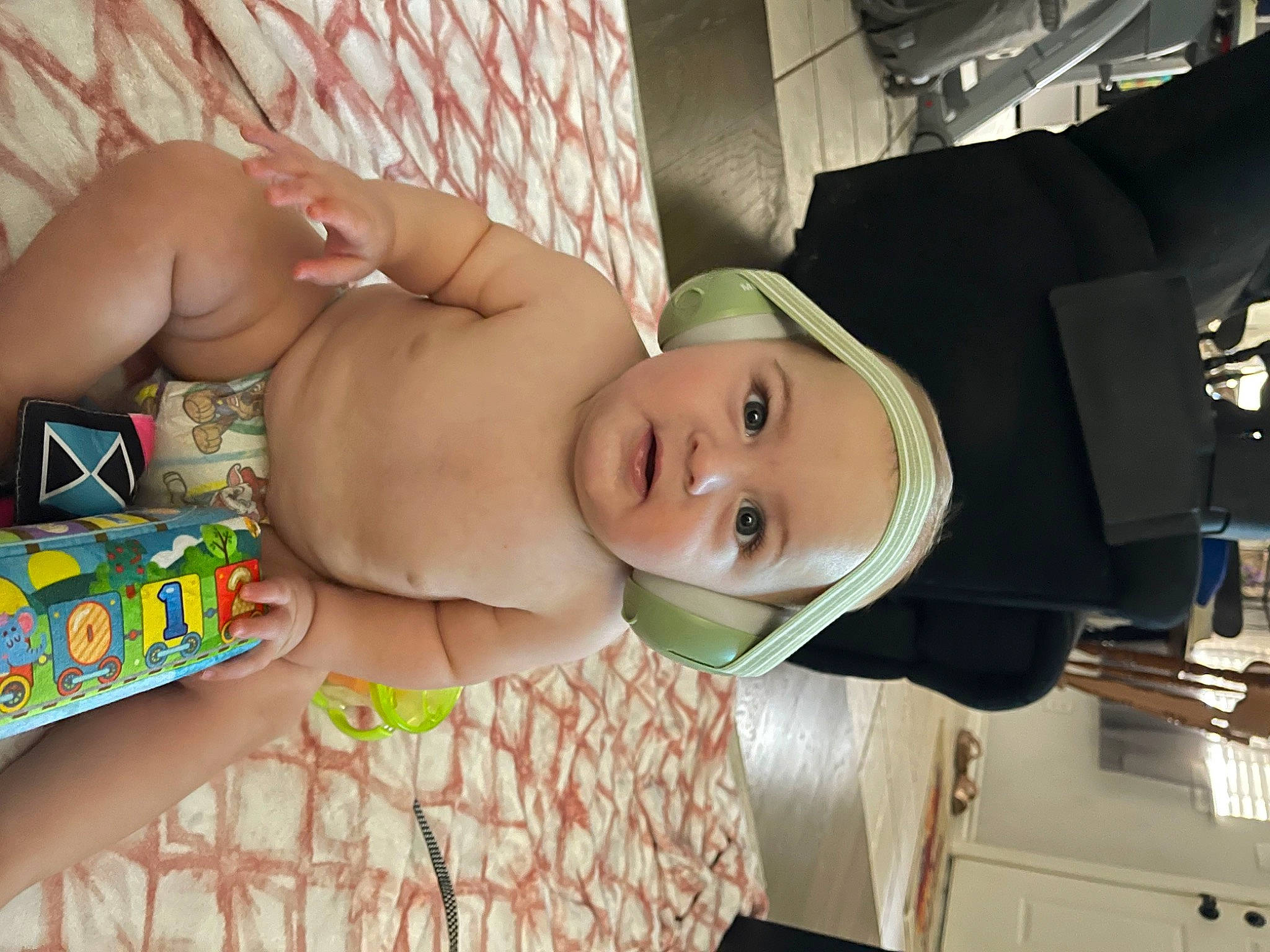 Bentley is registered to the contest to win money with this photo: abdomen, baby, barechested, chest, child, comfort, flesh, fun, hat, human_leg, mouth, muscle, navel, person, room, stomach, thigh, toddler, trunk, undergarment