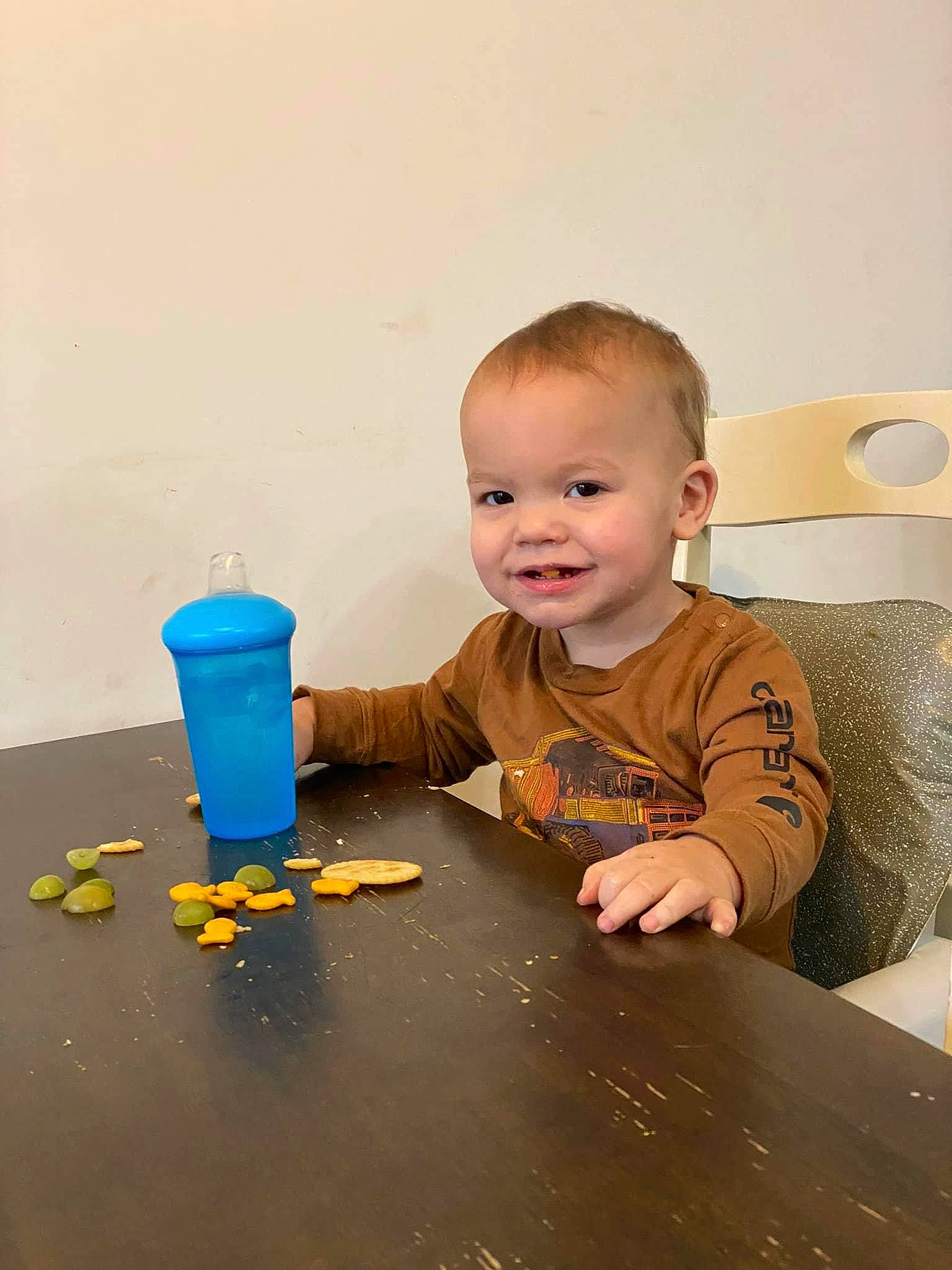Finley is registered to the contest to win money with this photo: baby, baby_playing_with_toys, baby_toddler_clothing, child, cone, flooring, fun, happy, hardwood, joy, person, plastic, play, room, sitting, smile, t_shirt, table, toddler, toy