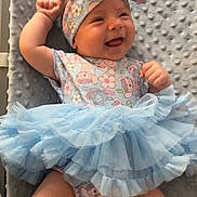 Amora joined the competition — help win amazing prizes! baby, smiling, tutu, blue, headband, floral, dress, sock, pink, cute, infant, happy, lying_down, fabric, texture, cheerful, child, soft, blanket, portrait