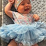 baby, smiling, tutu, blue, headband, floral, dress, sock, pink, cute, infant, happy, lying_down, fabric, texture, cheerful, child, soft, blanket, portrait