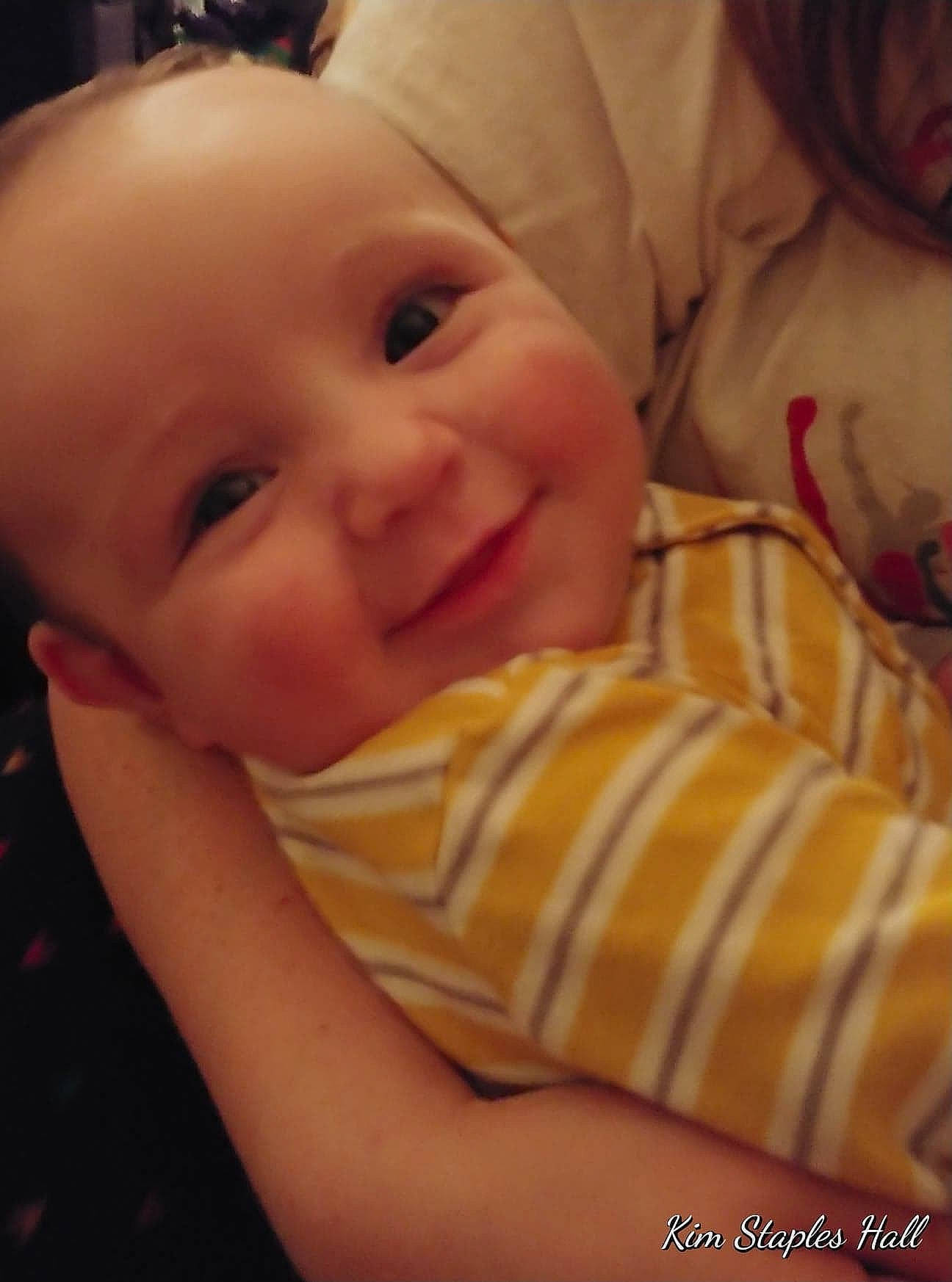 Alec is registered to the contest to win money with this photo: baby, beauty, cheek, child, chin, ear, eye, face, facial_expression, finger, happy, head, iris, joy, lip, mouth, nose, person, skin, smile