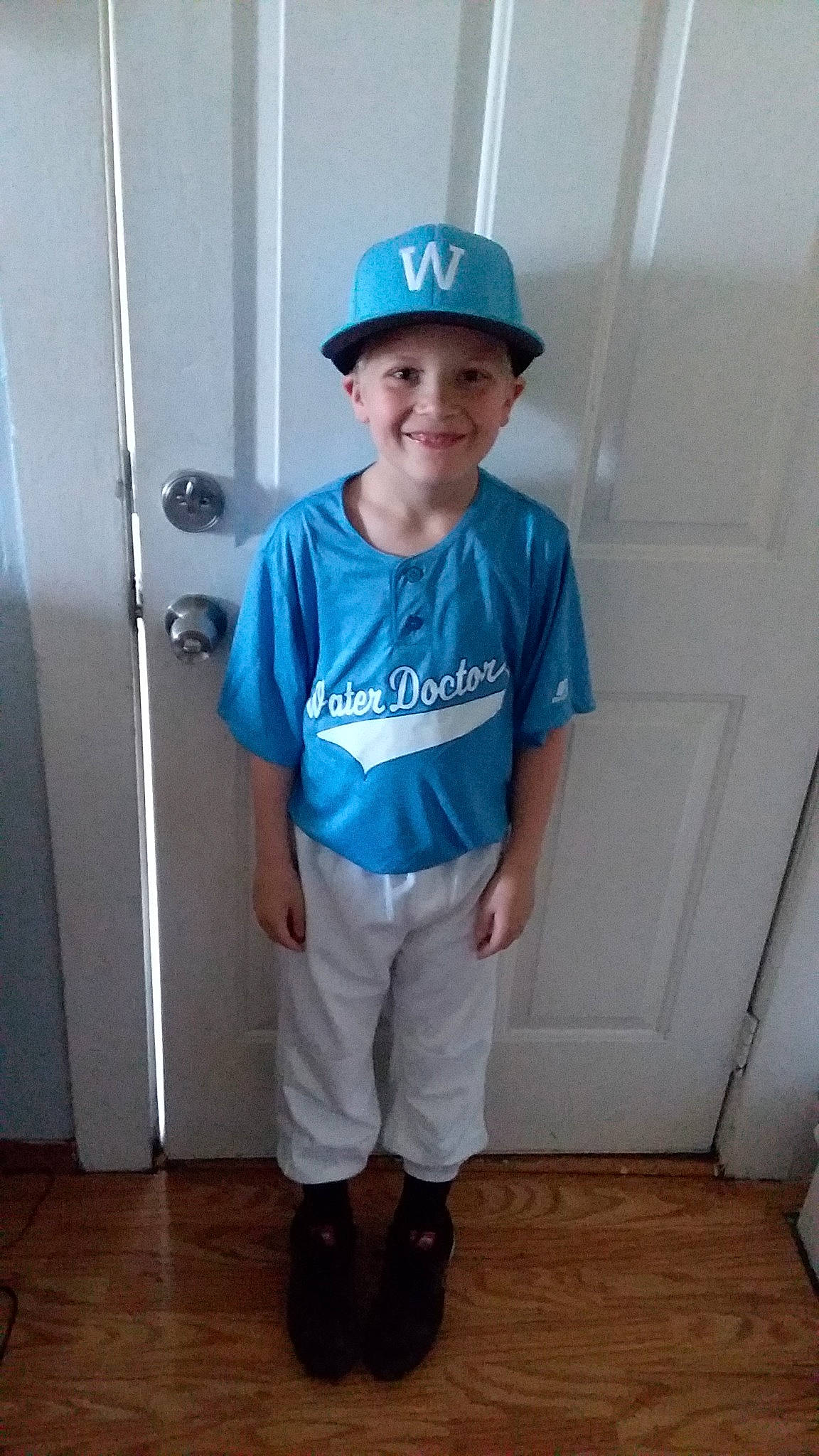 Elijah is registered to the contest to win money with this photo: baseball_cap, baseball_uniform, blue, cap, clothing, cool, costume, electric_blue, fashion_accessory, hat, headgear, headwear, joy, leg, male, person, shoulder, sleeve, sports_uniform, standing