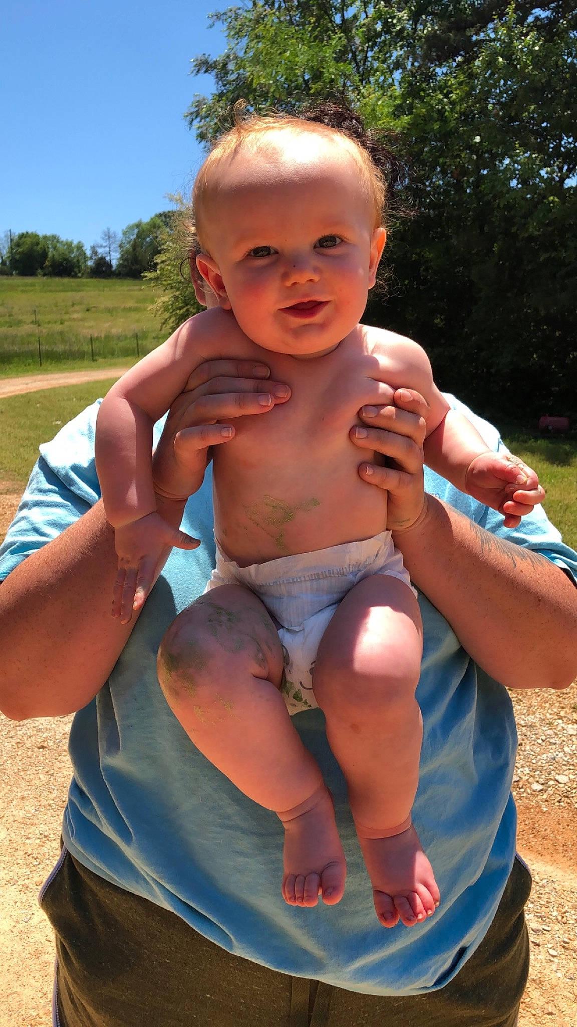 Travis is registered to the contest to win money with this photo: barechested, barefoot, child, muscle, person, smile, summer, toddler