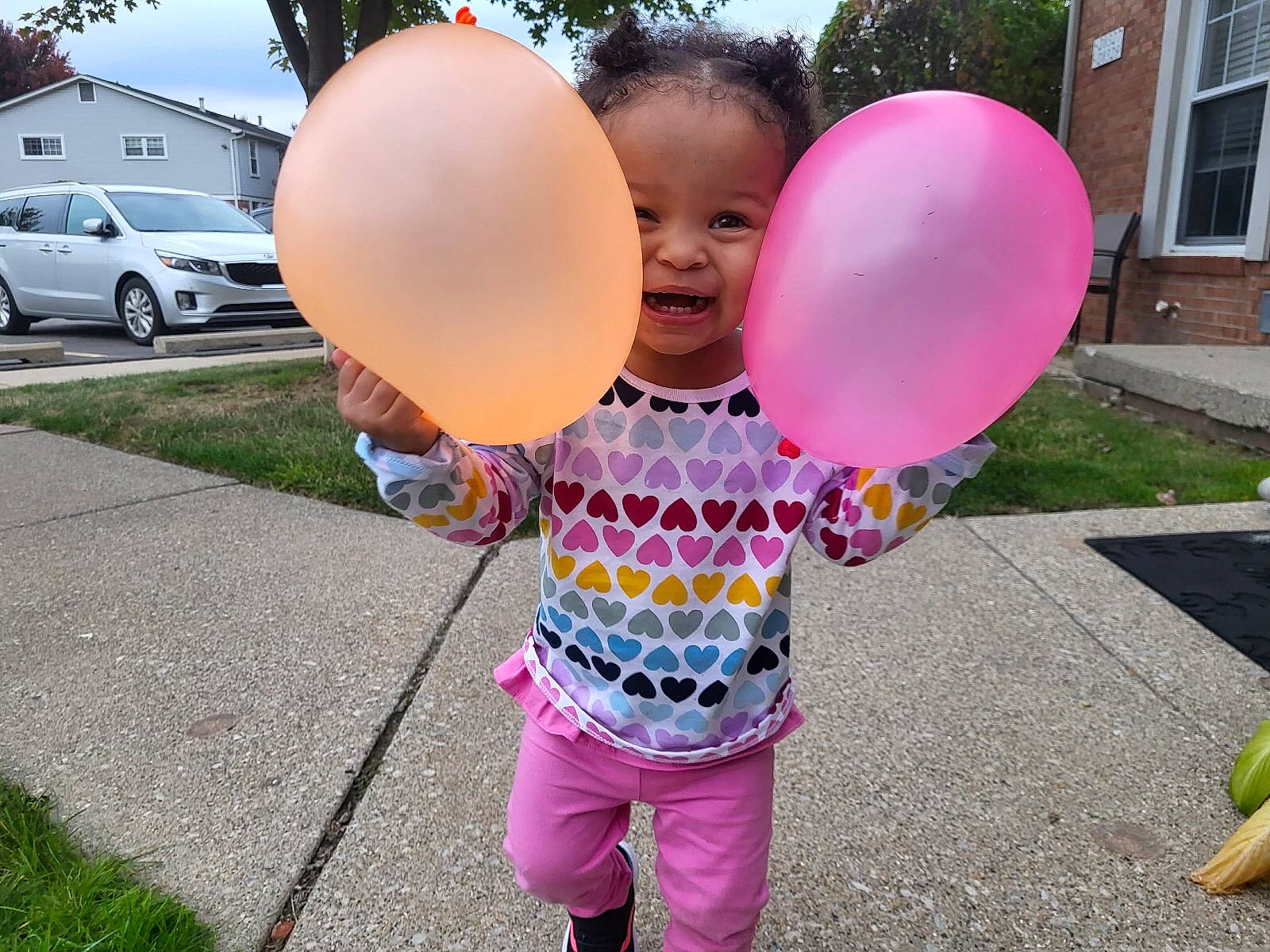 Aubrey joined the competition — help win amazing prizes! balloon, car, child, fun, grass, happy, leisure, magenta, party_supply, person, pink, recreation, smile, summer, t_shirt, tire, toddler, tree, vehicle, wheel